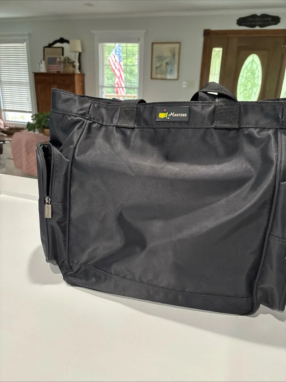 The Master’s officially licensed Black Tote Bag with Green Golf Flag Logo